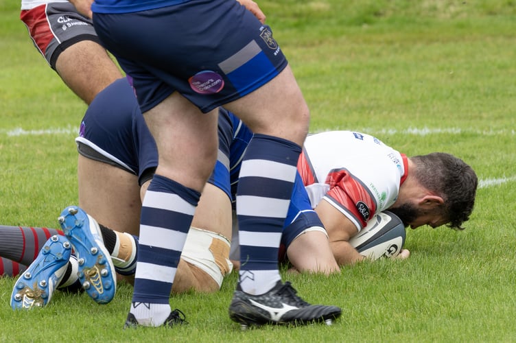 Camborne's Ben Priddey grounds the first try of the new season in the big win over Macclesfield in West Cornwall. Picture: Steve Mock.