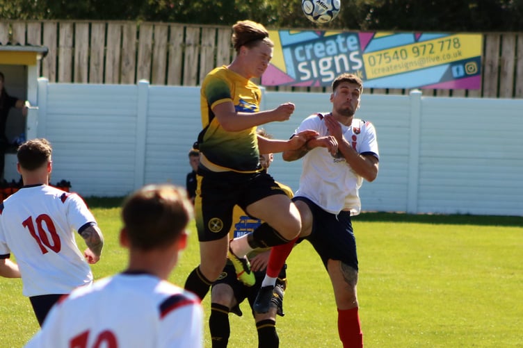 Torpoint's Fred Chapman, pictured heading clear against Wellington back in September, was twice denied in stoppage-time by Brislington keeper Ryan Smallwood. Picture: Torpoint Athletic