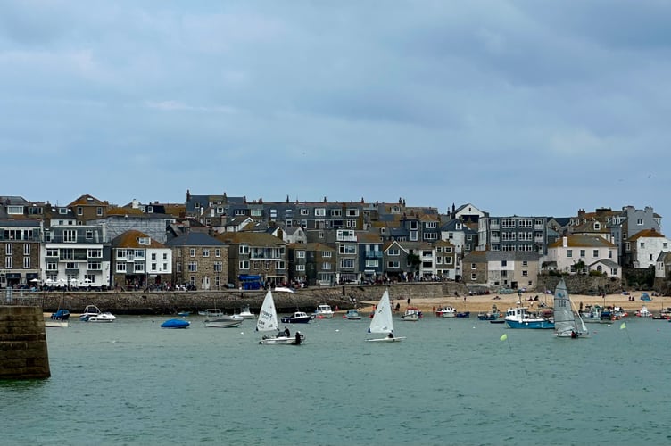 Busy day in St Ives harbour on a sunny Saturday afternoon