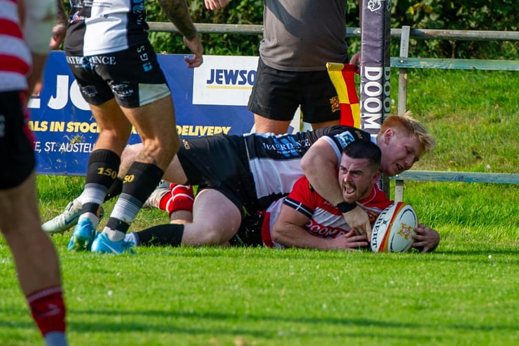 St Austell’s Dan Tyrrell, pictured scoring a match-winning try against Brixham earlier in the season, scored a hat-trick at Royal Wootton Bassett on Saturday on his return to his favoured wing position. Picture: Dave Phillips