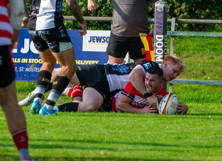 St Austell’s Dan Tyrrell, pictured scoring a match-winning try against Brixham earlier in the season, scored a hat-trick at Royal Wootton Bassett on Saturday on his return to his favoured wing position. Picture: Dave Phillips