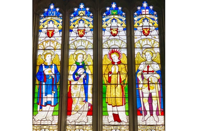 Part of the east window at St Blazey Parish Church depicting, from left to right, the archangels Raphael, Gabriel, Uriel and Michael.