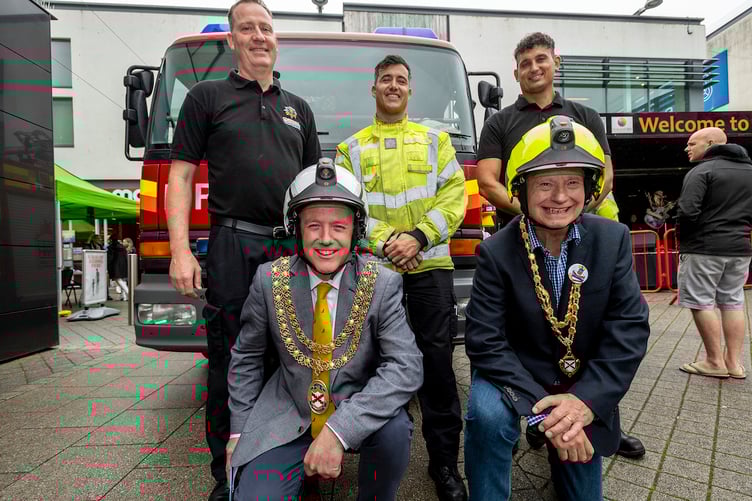 Mayor Julian Young and deputy mayor Colin Hamilton with St Austell firefighters at the fun day. Picture: Paul Williams