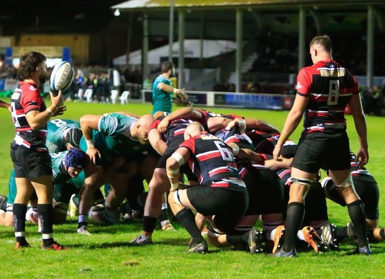 Both teams prepare for a scrum at the Mennaye Field on Friday night Picture: Brian Tempest
