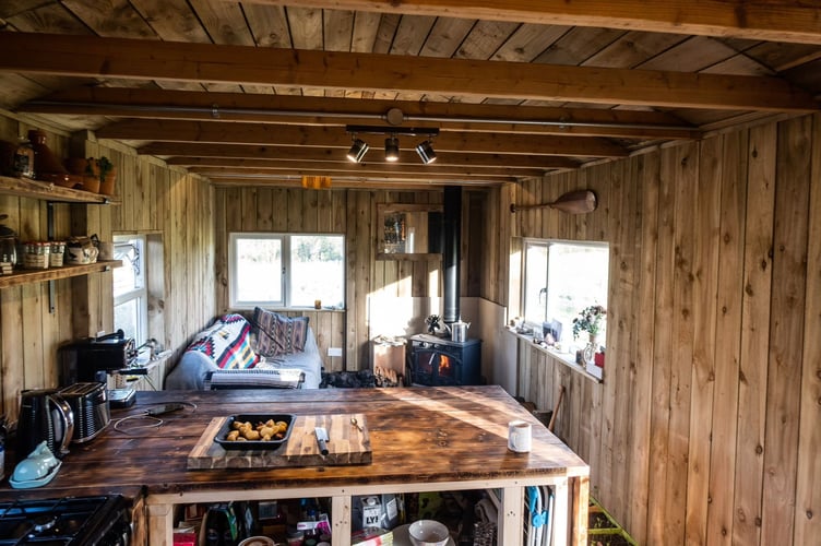 The static caravan after it was transformed into a log cabin. A man spent £10k transforming a static caravan into a log cabin in just four months. Benn Berkeley, 38, lost all his work prospects as a freelance film-maker in 2020 due to the pandemic. At the time, he was living in a house share spending £500-a-month on rent but realised he wanted a different lifestyle. In August 2020, his brother took over a farm which had a static caravan on and asked Benn if he wanted it.