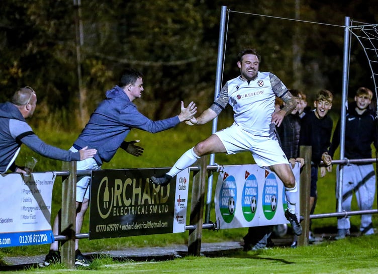 St Austell's Liam Eddy, pictured scoring against Buckland Athletic recently, found the net twice at Mill Road. Picture: Paul Williams