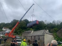 Up, up and away as crane extracts lorry stuck in a Forder lane 
