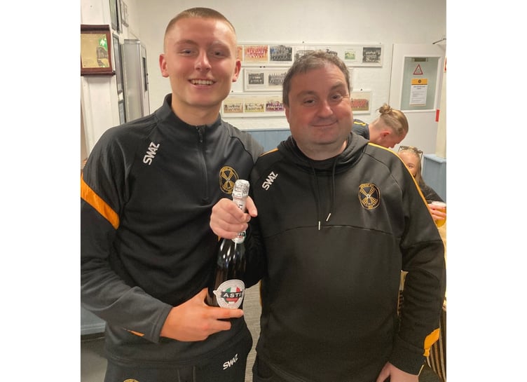 Torpoint Athletic secretary Robbie Morris presents the man of the match award to Mason Elliott. Picture: Torpoint Athletic AFC
