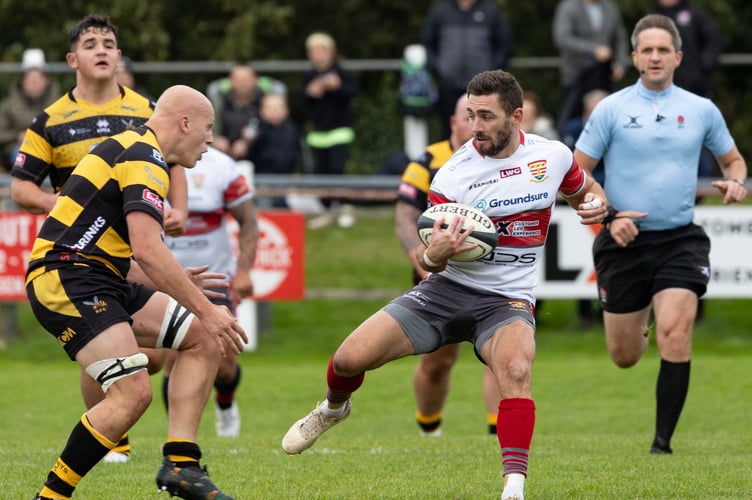 Camborne's man of the match Kyle Moyle makes another break in the victory over Hornets. Picture: Steve Mock