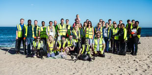 Staff at holiday park help clear up the coastline
