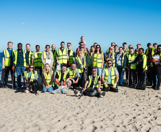 Staff at holiday park help clear up the coastline