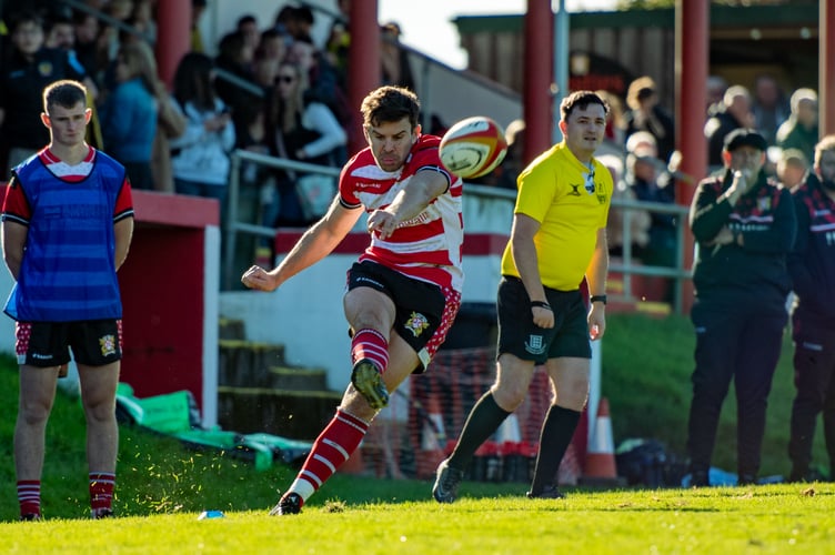 Chris Ashwin nails a fine conversion from the touchline as the large crowd watches on. Picture: Dave Phillips