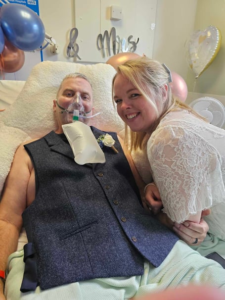 Mike Reynolds, getting married to Lara Reynolds in hospital. A woman married her husband in hospital 48 hours before his death - and has shared her story to raise awareness of his disease. Mike Reynolds was in hospital suffering from recently diagnosed pulmonary fibrosis. He married partner of eight years Lara in a touching ceremony organised by the bride in just one day. After delivery driver Mike was diagnosed with the lung condition in May the couple's life "turned upside down." 