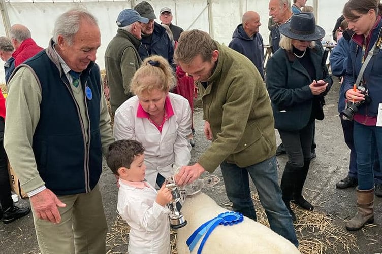 A YOUNG winner receives his trophy at a previous Primestock Show