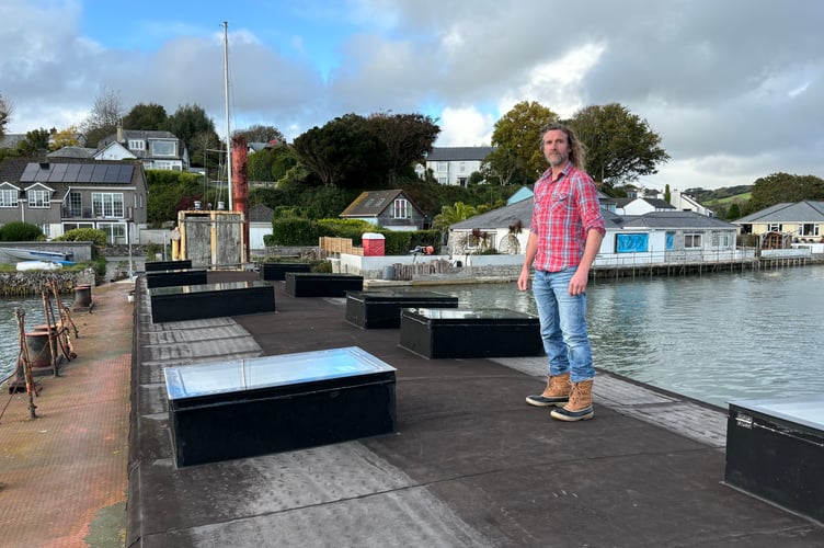 Dean Richards on his barge which is moored on his own land on the foreshore at Point quay near Truro (Picture: Lee Trewhela/LDRS)