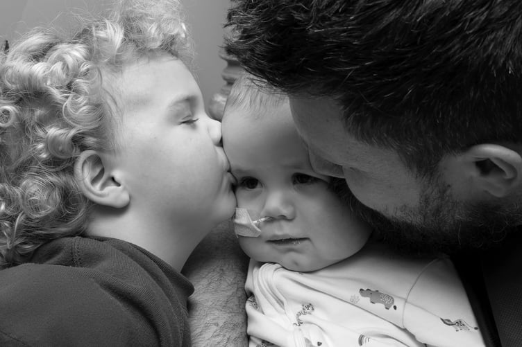 Noah Jordan with big brother Freddie and dad Ben