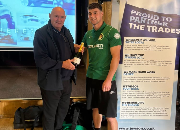 St Blazey left-back Ben Rowe receives his man of the match award from club legend Dave Pearce. Picture: St Blazey AFC