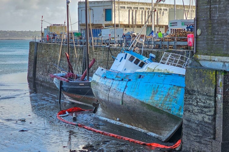 The Karina Olsen pictured after it sank in Penzance harbour.