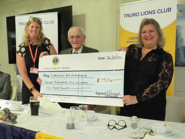 Truro Lions president Mike Kalis presents a cheque to Karen Hurn and Jen Morgan from Cornwall Air Ambulance Trust