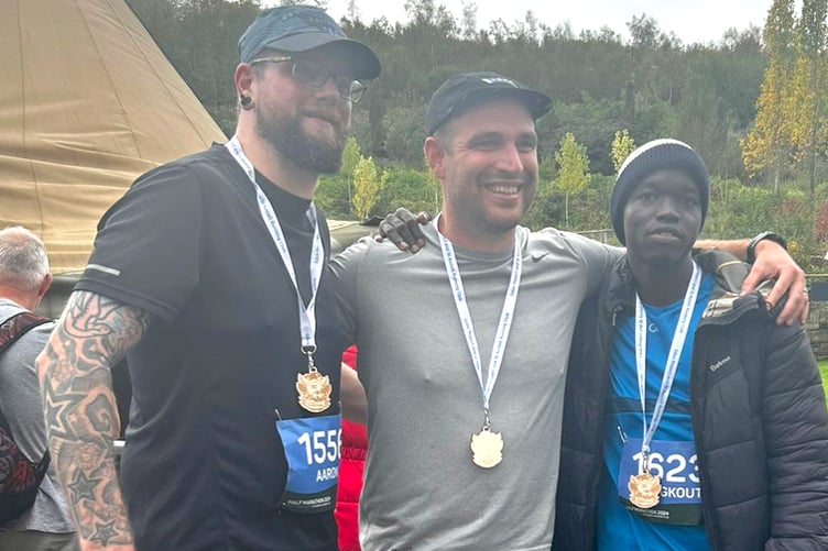 Aaron Insley, Matt Crocker and Changkouth Kuek after completing the Eden Project Half-Marathon.