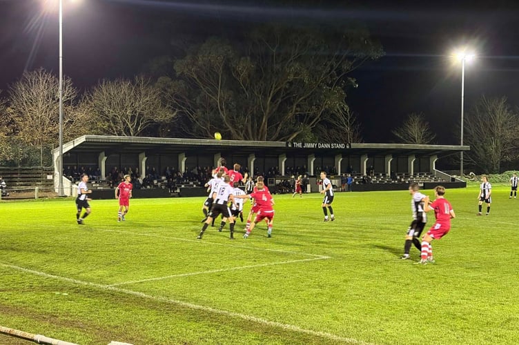 Bude Town look to attack a ball into the box at Penzance on Wednesday night. Picture: Bude Town AFC