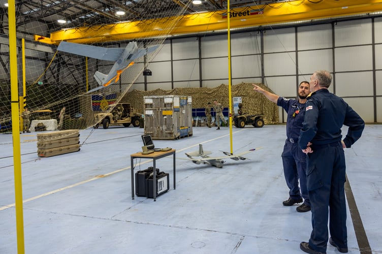  

The Chief of the Defence Staff Admiral Sir Tony Radakin meets personnel at 700X Naval Air Squadron, based at RNAS Culdrose. Five years ago, when he was First Sea Lord, Admiral Radakin directed the fleet Air Arm squadron to begin trials with drones. They are regularly deployed on warships around the world. He was given demonstrations of the squadron Puma, Banshee and Peregrine remotely-piloted air systems.

 

The Chief of the Defence Staff Admiral Sir Tony Radakin talks to sailors and civilians from across RNAS Culdrose during a visit to the Cornish air station. The event was held in the hangar of 700X Naval Air Squadron.

 

The Chief of the Defence Staff Admiral Sir Tony Radakin presents Lieutenant Commander Ian âNurseyâ Mailes with his valedictory certificate after he retired from the Royal Navy after 34 yearsâ service. Lt Cdr Mailes served as a helicopter observer in Sea King and Merlin aircraft, based mainly out of RNAS Culdrose.

 

The Chief of the Defence Staff Admiral Sir Tony Radakin presented a valedictory certificate to Lieutenant Commander Alastair âBouncyâ Castle years. They both served together in 1990 on their first ship as lieutenants and have remained good friends. Lt Cdr Castle trained as a pilot in Sea King and Merlin helicopters and has spent most of his career at RNAS Culdrose.