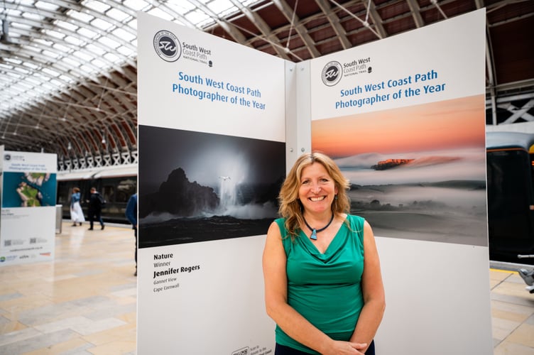 Jennifer Rogers, winner of last year's Nature category in the South West Coast Path Photography Competition, at Paddington Station with her winning shot: Gannet View, taken at Cape Cornwall 