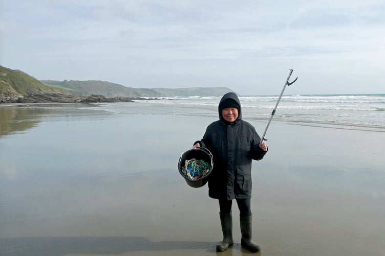 Rowena Castillo-Nicholls with rubbish she collected on West Portholland Beach.