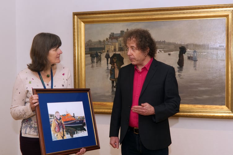 Nick Langdon presents drawing to Penlee House Museum and Gallery. L-r Katie Herbert curator/deputy director Penlee House and Nick Langdon.