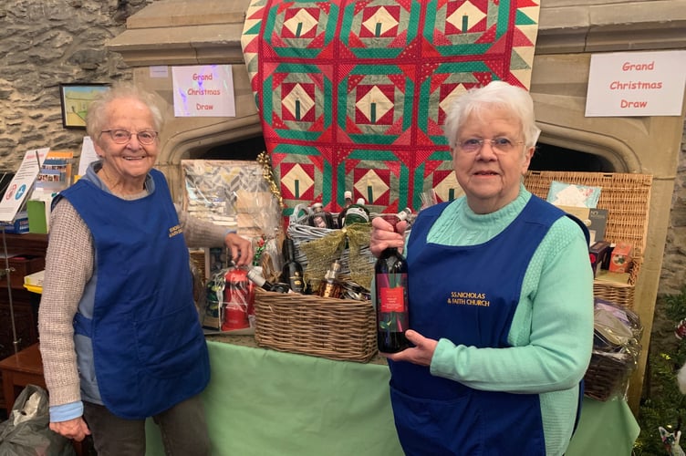 Leslie Stevens (left) and Margaret Evans organise the Christmas tree event each year for St Nicholas and St Faith in Saltash, with their grand Christmas draw and luxury main prize, £1 per ticket. (Picture: Sarah Martin)