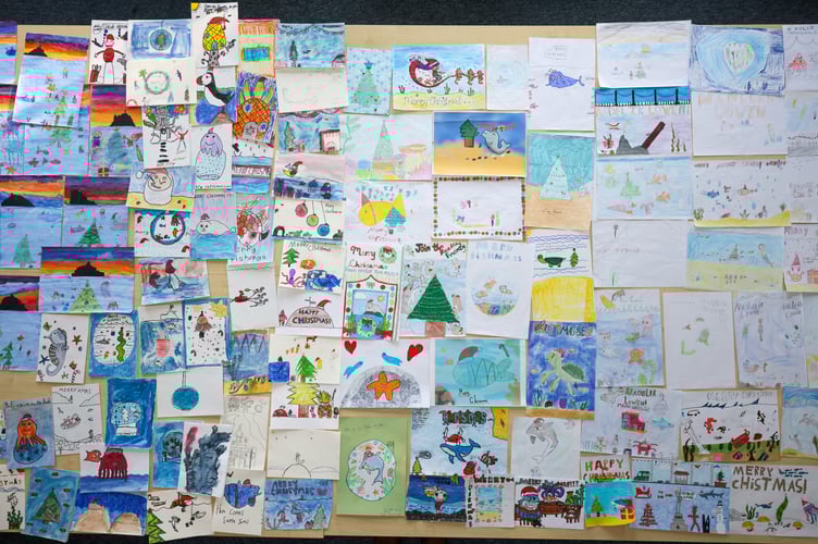 Mayor of Penzance, Stephen Reynolds chooses a winner from the 175 entries for his annual Christmas Card Competition. Photo by Penzance Council.