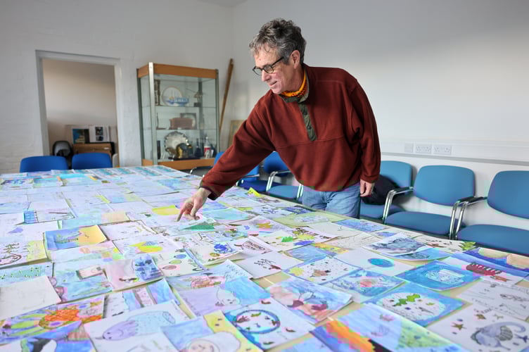 Mayor of Penzance, Stephen Reynolds chooses a winner from the 175 entries for his annual Christmas Card Competition. Photo by Penzance Council.