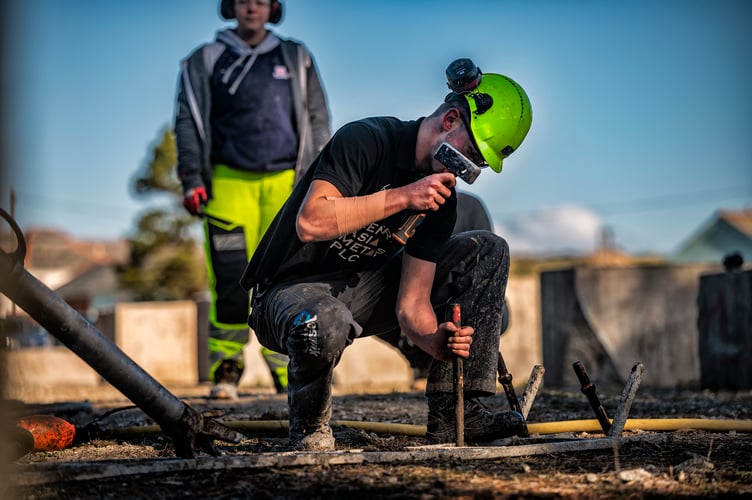 International Mining Games President for 2024 2025, Joseph McCarthy, preparing the training ground for the jackleg drilling - Image Credit Media Memories Photography