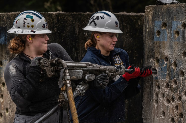 Camborne School of Mines' women's team training for the jackleg drilling event - Image Credit Media Memories Photography