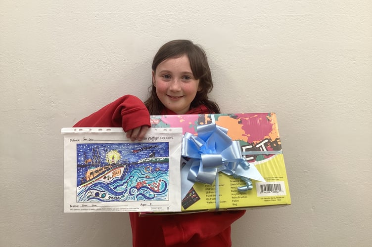 Grace Shore with her prize and design.