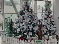 Businesses decorate Christmas tree to raise money for charity