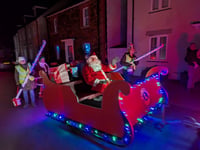 Father Christmas visiting neighbourhoods to bring festive cheer