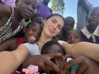 Teenager brings Christmas cheer to Uganda township's children