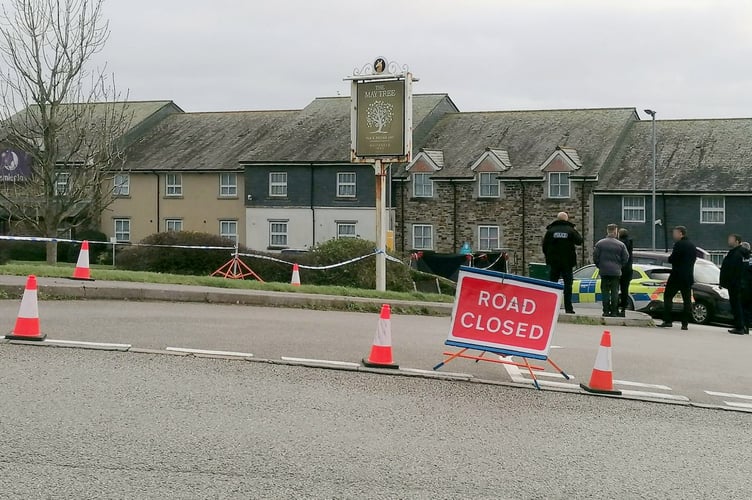 Police at the scene in Helston where the discovery of man's body in car has sparked a murder probe.  Release date  December 19, 2024.  Two women - including one in her 80s - have been arrested on suspicion of murder and concealing the body of a victim.  The suspects were detained after a murder probe was launched after the body of a man was found in a vehicle at the Helston Business Park in Cornwall.  Police were making enquiries in the Helston area in the early hours of Wednesday 18 December following concerns for welfare.  A man in his 60s, from the Somerset area, was confirmed dead at the scene. His next of kin have been informed.  Two women aged in their 50s and 80s, also from Somerset, have been arrested on suspicion of murder, concealing a death, and preventing a lawful burial. They remain in police custody at this time. 