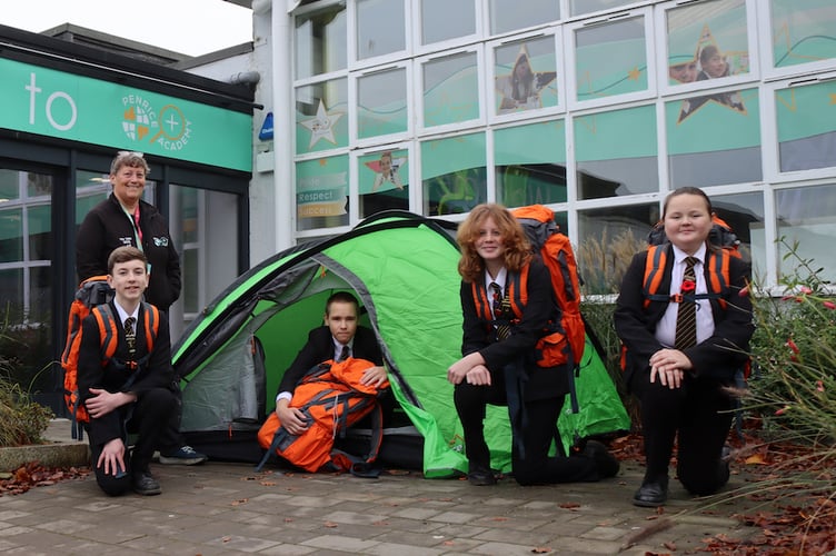 Alison Penrose shows some of the outdoor equipment to Penrice Academy students.