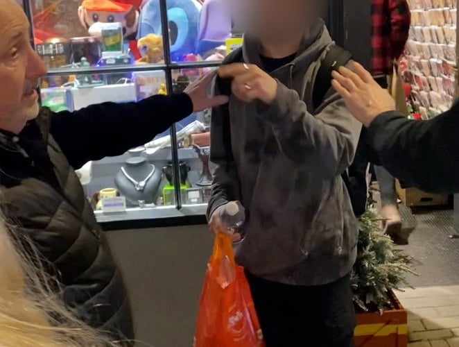 Happy Piranha store owner Martin Gaunt, accompanied by his two sons, approach shoplifters outside his store in Truro, Cornwall. Release date December 20 2024. Video shows suspected shoplifters being confronted by a shopkeeper - who says he has carried out more than 50 citizen's arrests on thieves in two years. Martin Gaunter says he feels left with no choice other than to front up to offenders to protect his shop Happy Piranha in Truro, Cornwall.  The shopkeeper has defied criminals inside and outside his shop - telling them he has the right to detain them until police arrive. He has also installed 12 CCTV cameras across the three shops he has in the seaside town centre.  However, the 62-year-old says he doesn't have 'proper' support from the police - adding that the criminality is affecting the whole community in town.