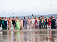 Brave souls glammed up to enjoy a dip and see out the year in style