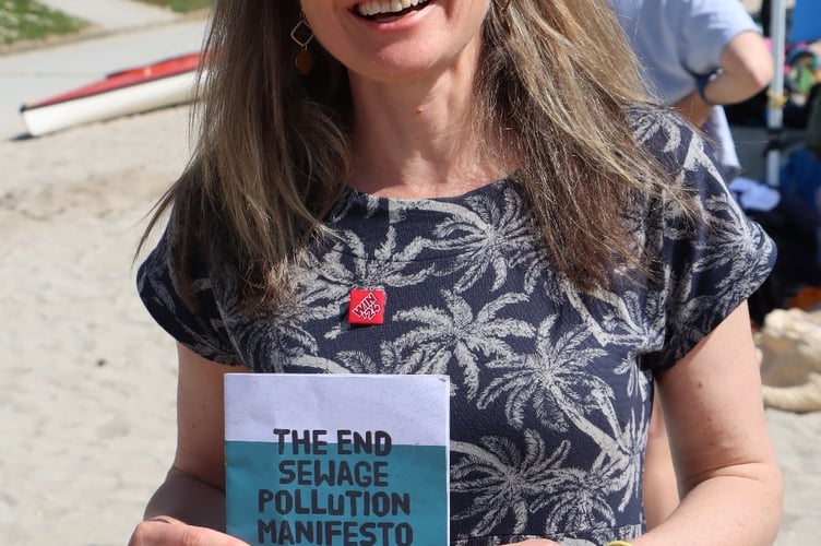 Jayne Kirkham, Labour MP for Truro and Falmouth, with the 'End Sewage Pollution Manifesto' 
