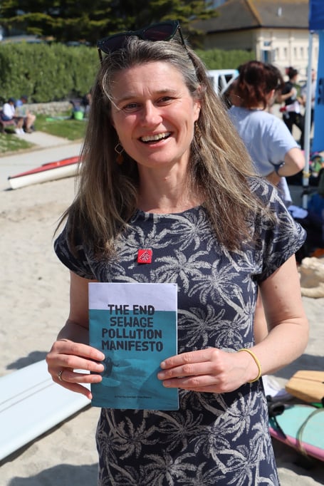 Jayne Kirkham, Labour MP for Truro and Falmouth, with the 'End Sewage Pollution Manifesto' 