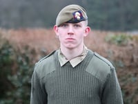 Trainee soldier talks with Prince Edward at special parade
