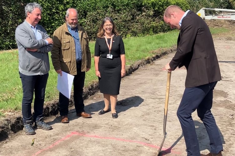 Prince William breaking ground.
