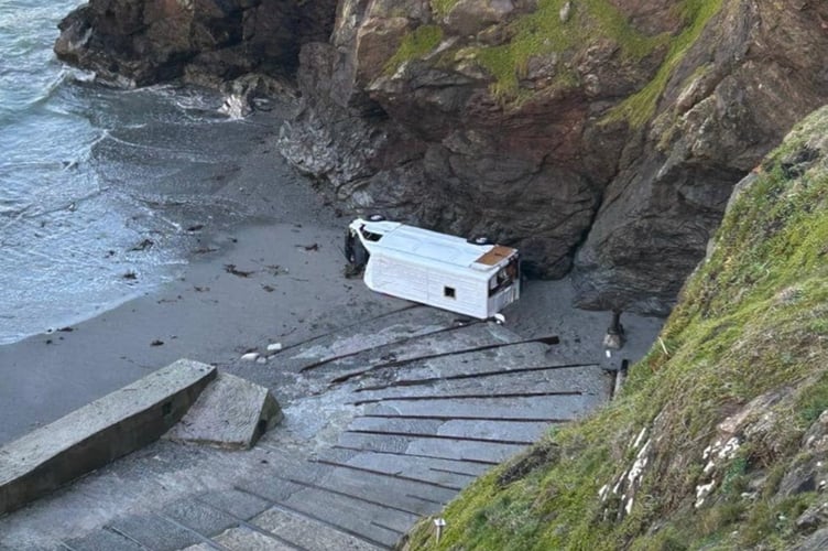A van that has fallen down the cliffs at Polpeor Cove, Cornwall. A van driver had a very lucky escape after his vehicle ended up on its side at the base of cliffs - and was nearly washed out to sea. Pictures shared by coastguards showed the van at the bottom of steps at Lizard Point in Cornwall. There are no reports of any injuries but people are being advised to stay clear of the vehicle if they go to Polpeor Cove. According to one eyewitness who was at the scene, emergency services were seen at the location, with the coastguard also in attendance. 