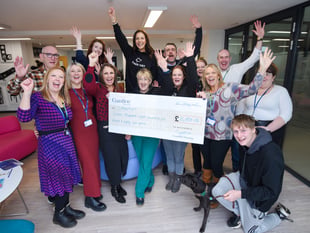 Celebrity pops into homeless centre to help with fundraising handover