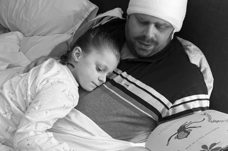Marcus Williams with daughter Lola post surgery. Photo released February 11 2025. A dad lost all memory of his family and even forgot his own name as a result of an aggressive brain tumour - after being misdiagnosed with vertigo.Marcus Williams, 35, began experiencing intense headaches, fatigue, and seizures but doctors repeatedly misdiagnosed his symptoms for vertigo.The dad-of-one started to lose his memory - and couldn't recognise his daughter, Lola, five - and his wife, Laura, 31, pushed to get a CT scan.It revealed a large tumour and Marcus was rushed for emergency surgery to remove 98% of the mass - after being given hours to live.
