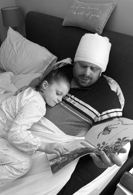 Marcus Williams with daughter Lola post surgery. Photo released February 11 2025. A dad lost all memory of his family and even forgot his own name as a result of an aggressive brain tumour - after being misdiagnosed with vertigo.Marcus Williams, 35, began experiencing intense headaches, fatigue, and seizures but doctors repeatedly misdiagnosed his symptoms for vertigo.The dad-of-one started to lose his memory - and couldn't recognise his daughter, Lola, five - and his wife, Laura, 31, pushed to get a CT scan.It revealed a large tumour and Marcus was rushed for emergency surgery to remove 98% of the mass - after being given hours to live.
